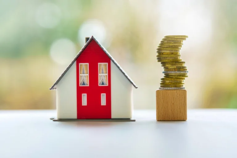 Model house with a coin tower next to it